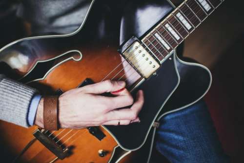 guitar pick strings hands musician