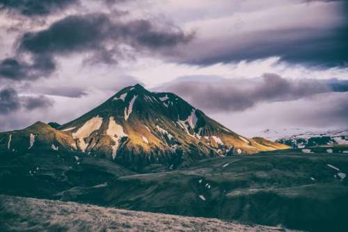 mountain highland clouds sky summit