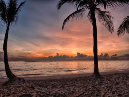 tropical beach sunset sky clouds