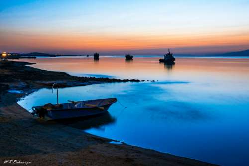 fishing boat sunset sea ocean