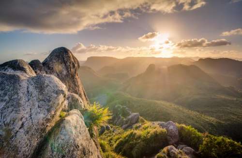 sunlight sun rays sky clouds mountains