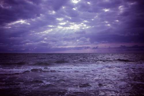 purple sky clouds storm ocean