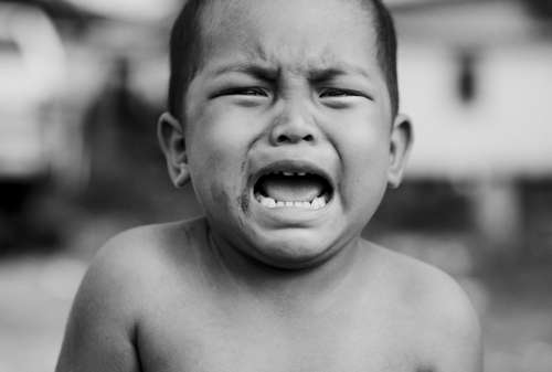 child crying black & white boy child