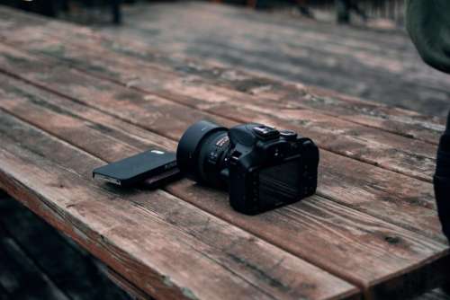 black camera dslr photography wooden