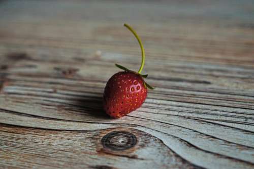 red strawberry fruits food wooden
