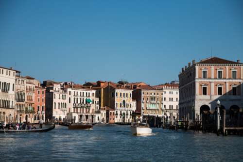 Venice sea boats blue sky buildings