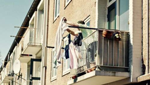 people lady woman hang balcony