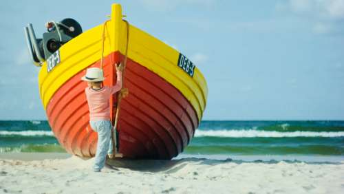 boy fishing boat red yellow