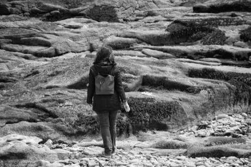 black and white people girl walking alone