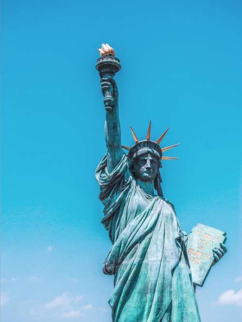 blue sky clouds liberty statue