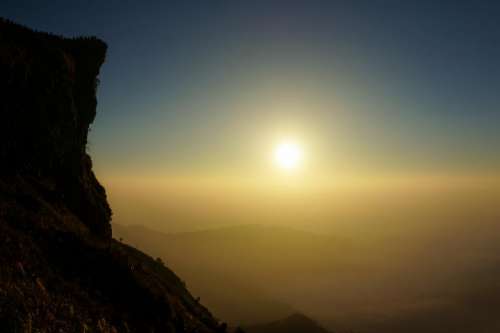 mountain highland cliff sunset sky