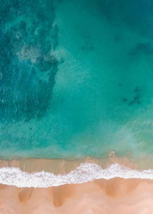 overhead drone beach sand ocean