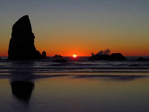 ocean beach sunset rocks waves