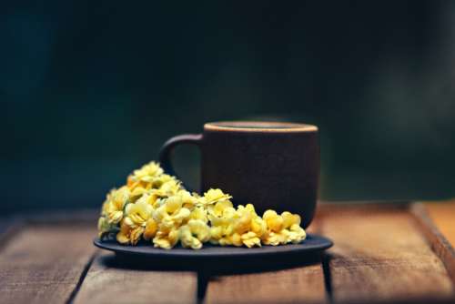 coffee plate flowers yellow wood