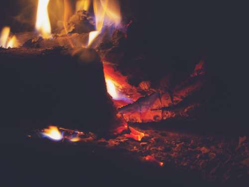 fire fireplace flames wood logs