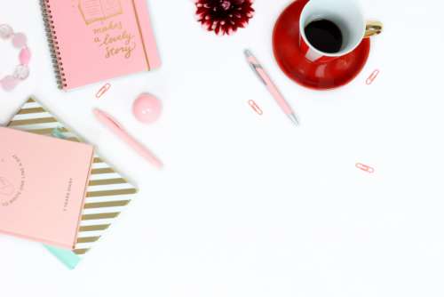 workplace desk feminine pink notebooks