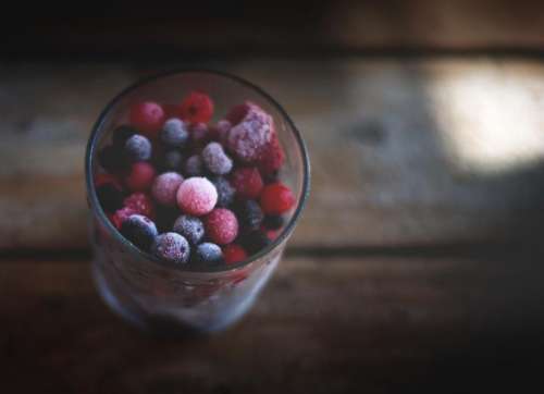 blueberries raspberries berries fruits glass