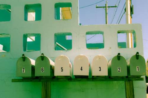 green mailbox yellow numbers letters