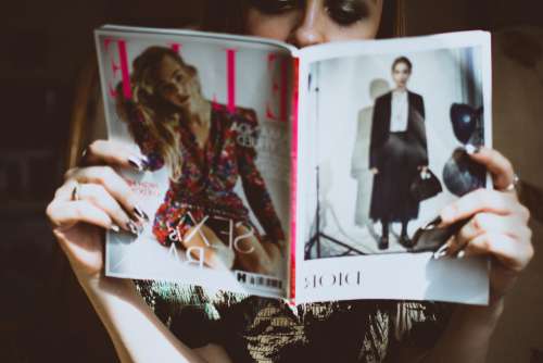 woman reading fashion magazine female