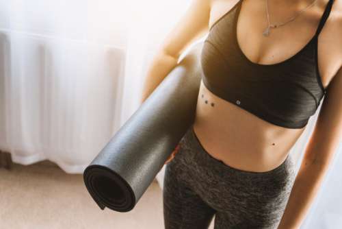 woman yoga mat workout sport