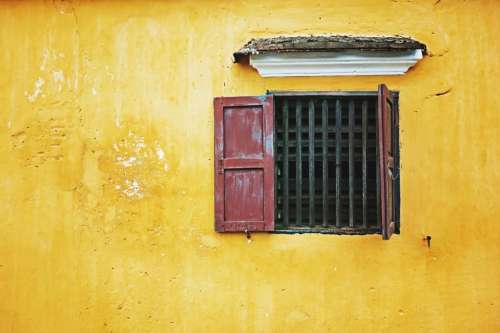 house yellow wall window frame