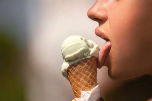 woman licking ice cream dessert female