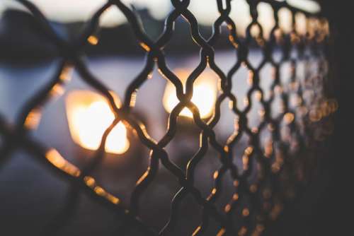 chainlink fence sunset evening dusk