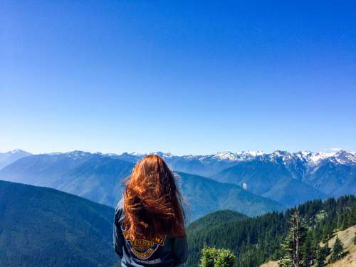 woman adventure landscape blue sky mountain