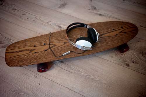 wood skateboard headphones flooring rustic