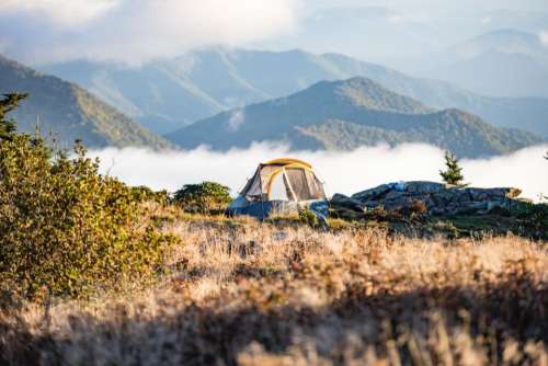 camp tent grass mountain hill