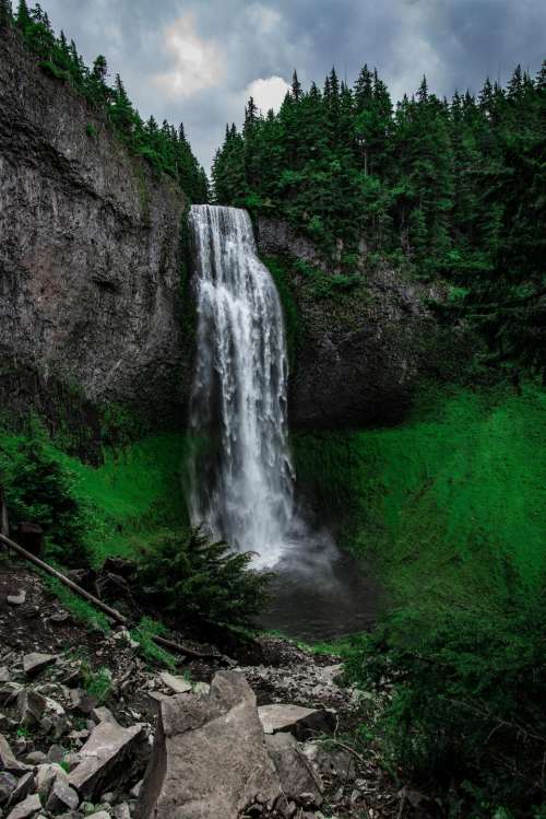 waterfalls green grass hill trees