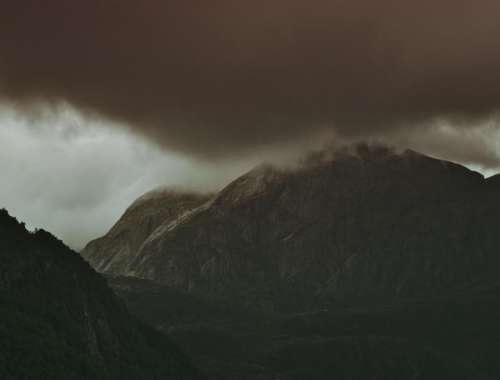 dark clouds mountain valley highland
