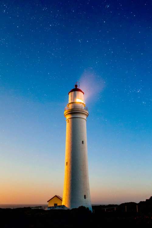 structure lighthouse sky night stars