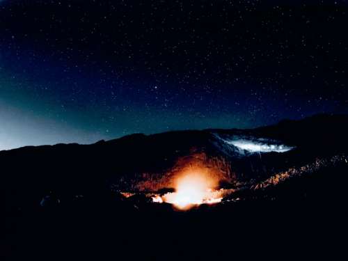 landscape fire night stars mountains