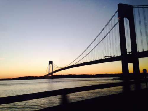 bridge water sunset suspension bridge no person