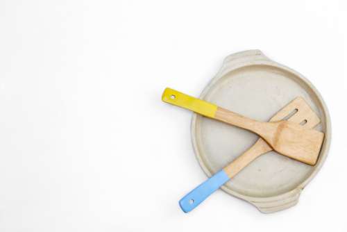 wooden spatula isolated cooking pan