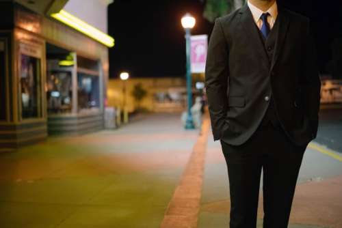 suit vest tie sidewalk street