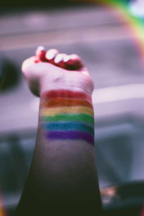 woman rainbow arm pride hand