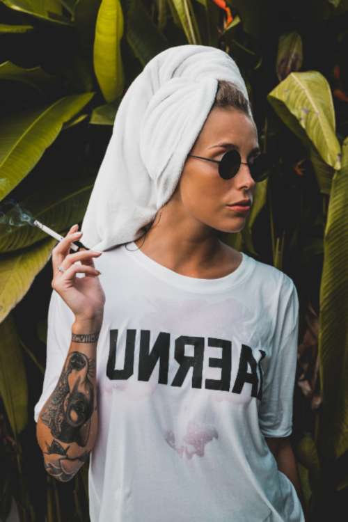 woman model smoking cigarette wet