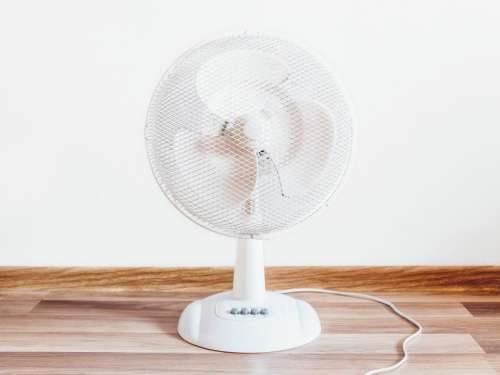 white fan objects hardwood floor