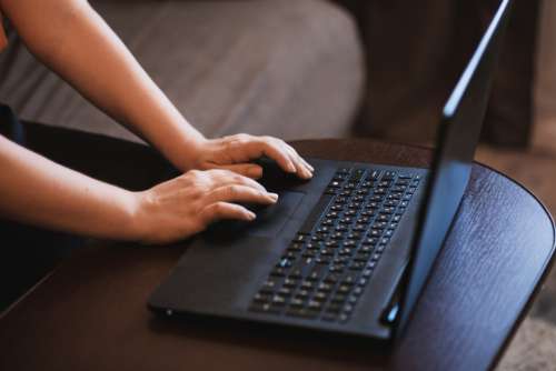 woman working laptop black computer