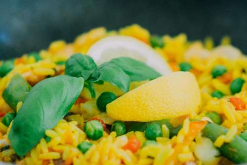 paella rice peas lemon food