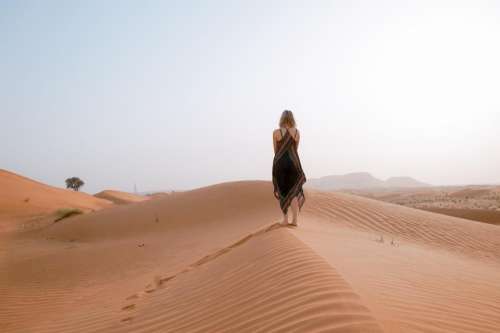 people girl walking alone desert