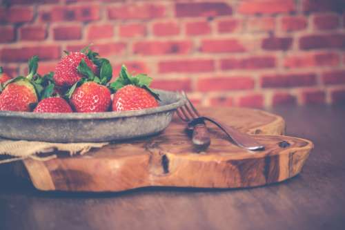 strawberries fresh plate wood table