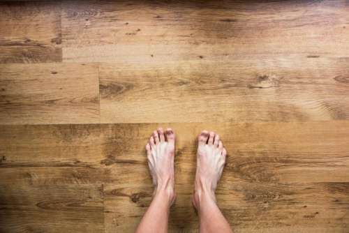 barefoot bare feet floor hardwood