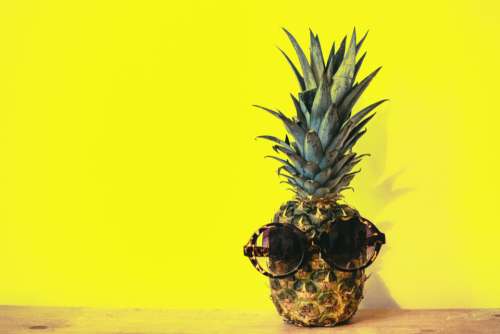 pineapple sunglasses yellow background minimal