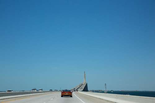 bridge traffic cars travel ocean