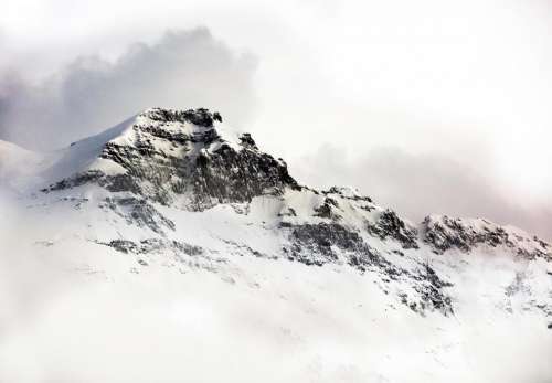 mountains cliff rocks snow cold