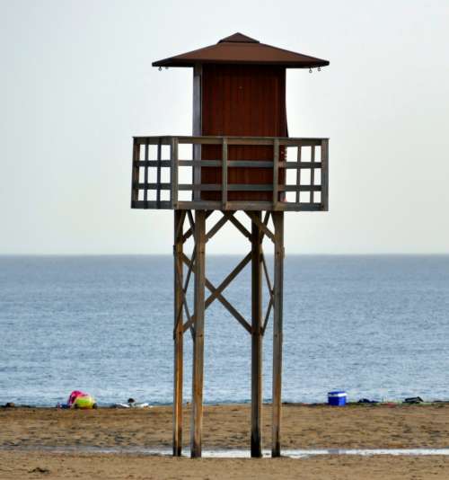 beach lifeguard tower ocean water