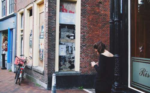 girl woman texting people city